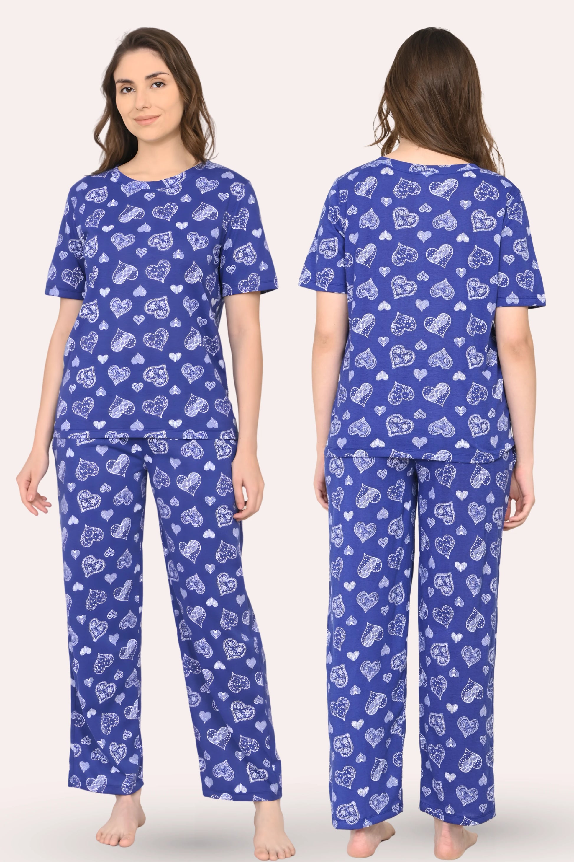 Woman wearing a navy pajama set with hearts patterns, shown from front and back