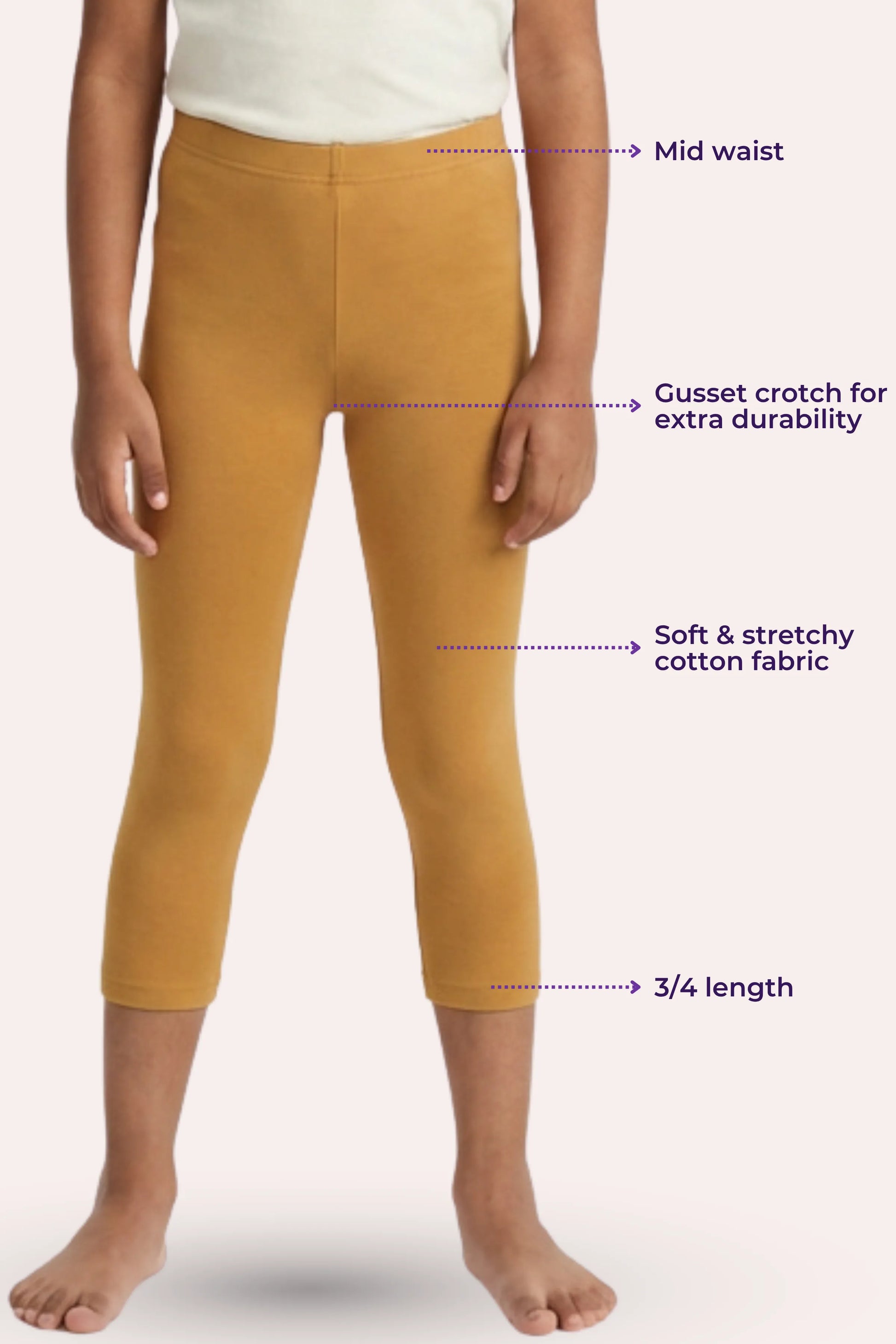 Mustard yellow leggings with text labels on a white background