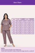 Woman wearing a brown leopard print outfit with a size chart