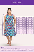 Woman wearing a blue floral dress with a size chart