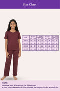 Size chart for children's pajamas with a model wearing the pajamas on a white background.