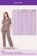 Woman wearing a brown leopard print outfit with a size chart