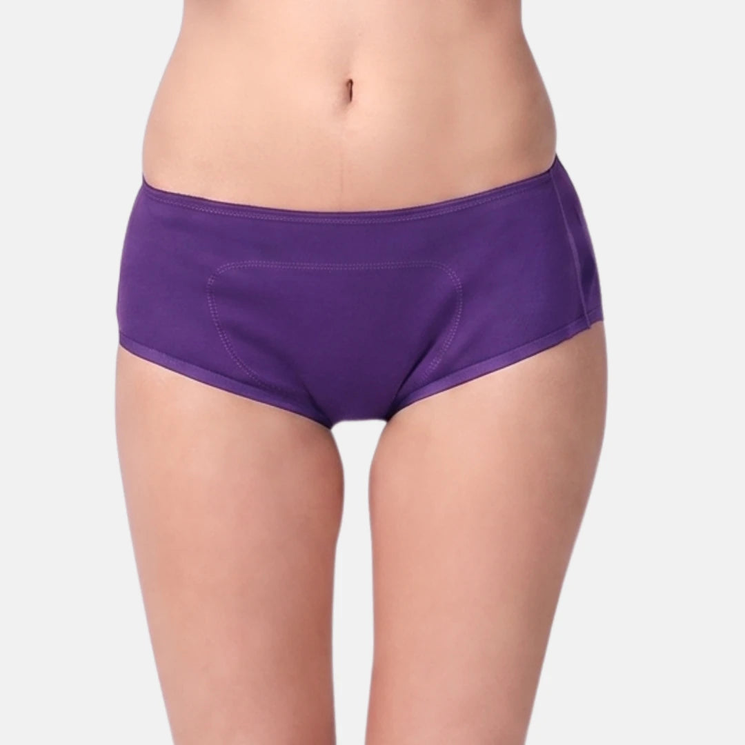 A model wearing a pair of magenta boxer against a light gray background.