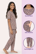 Teen wearing brown leopard print pajama set with close-up details