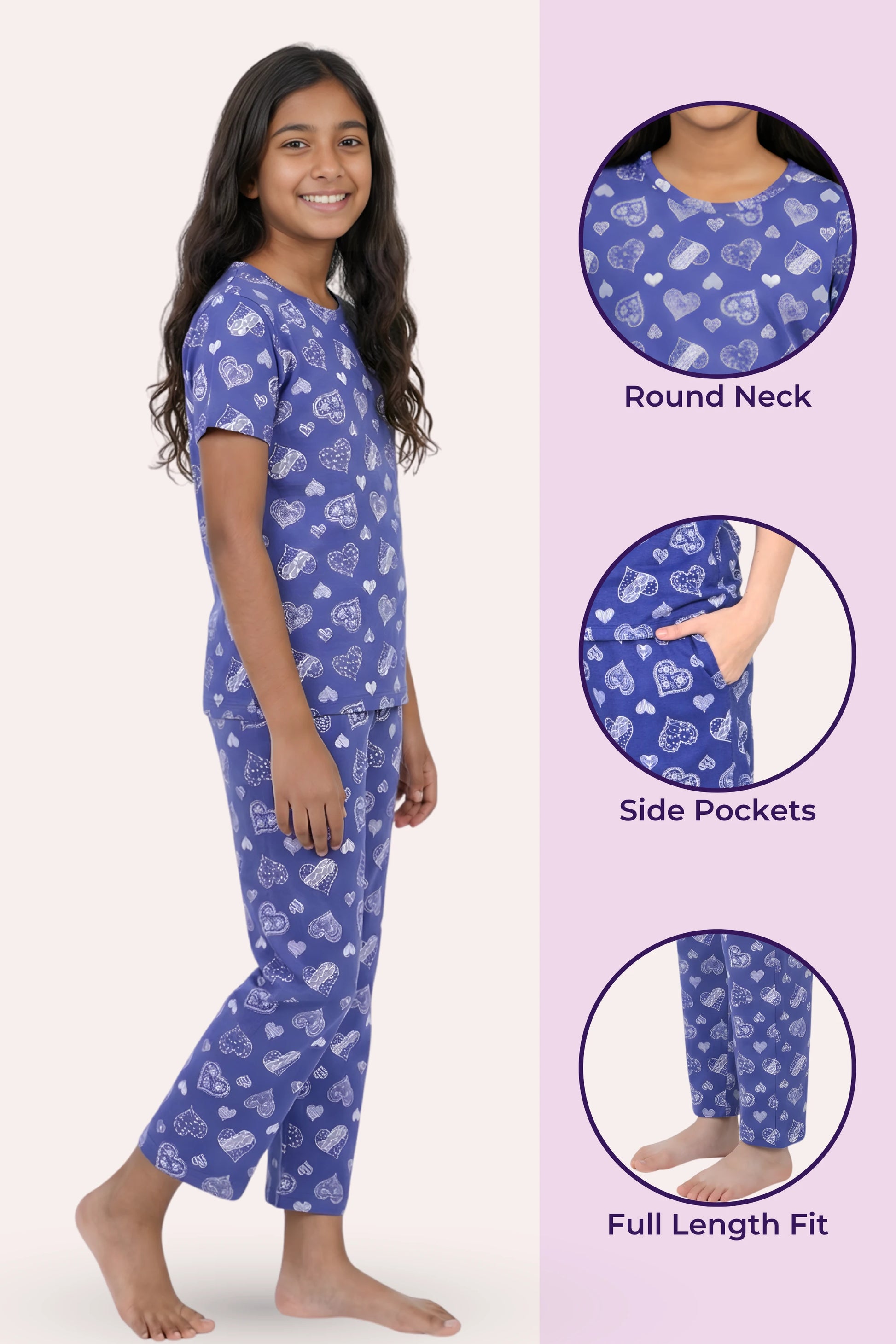 Girl wearing navy pajama set with heart pattern, featuring round neck, side pockets, and full length fit