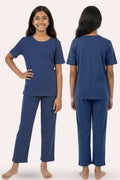 Two views of a person wearing airforce navy pajama set
