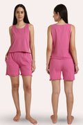 Woman wearing a rose sleeveless top and shorts set, shown from front and back