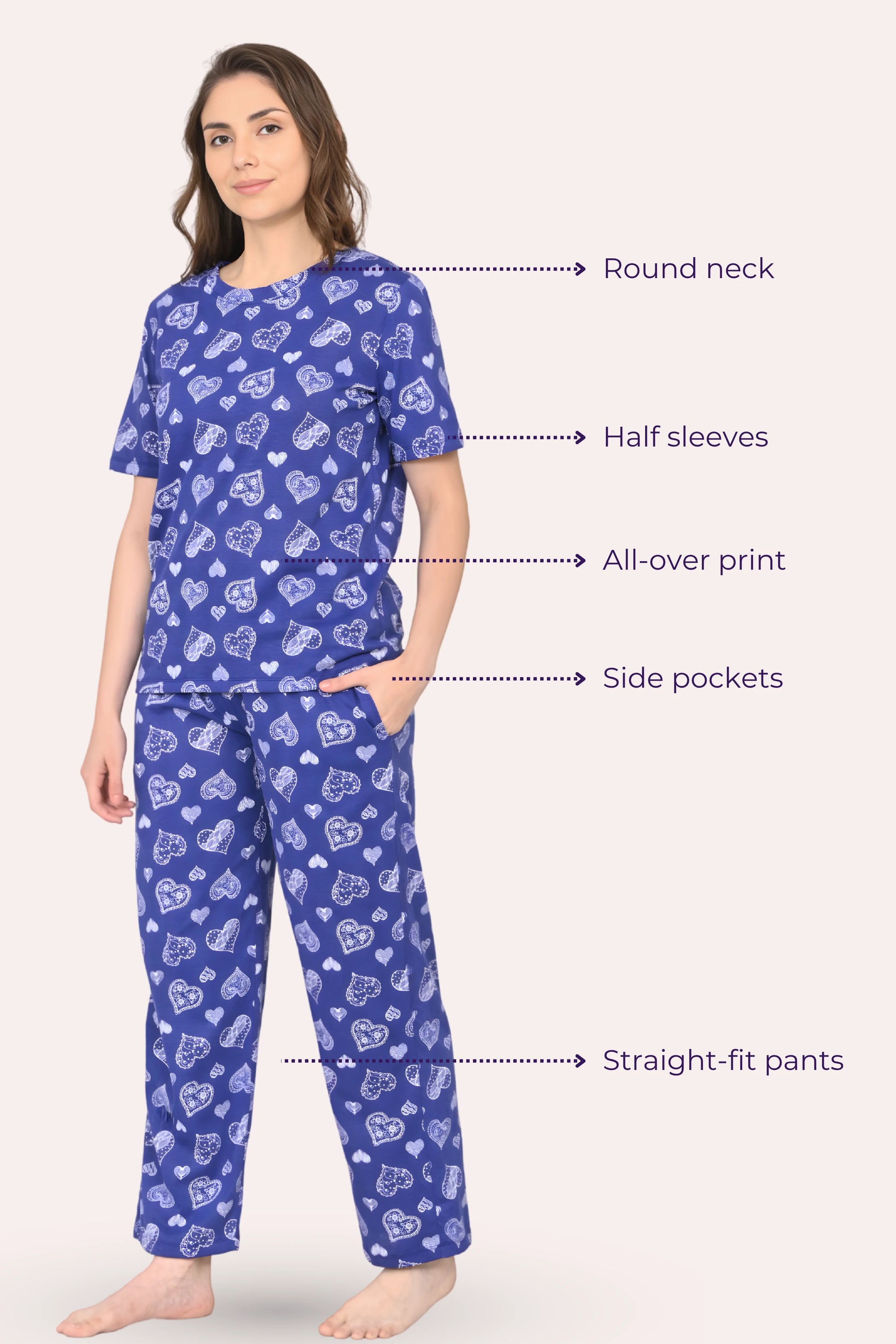 Woman wearing a navy hearts pajama set with printed design, labeled features